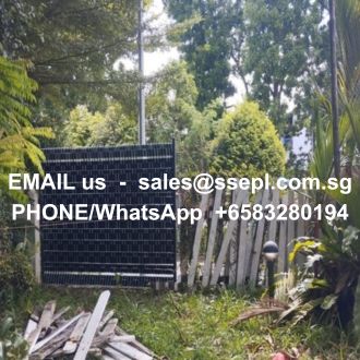 Solar panel in a garden with overgrown vegetation and a white text overlay that reads: 'EMAIL us - sales@ssepl.com.sg' and 'PHONE/WhatsApp +65 83280194'