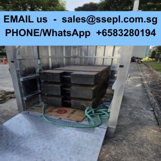 Open metal shipping container with stacked black crates inside; blue banner on top displays contact email and WhatsApp number.