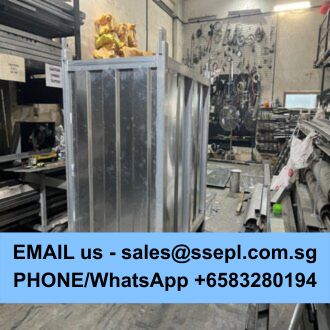 Industrial workshop showing a metal fabrication frame under construction, with tools and machinery on the walls; a blue banner across the bottom displays contact email and phone/WhatsApp number.